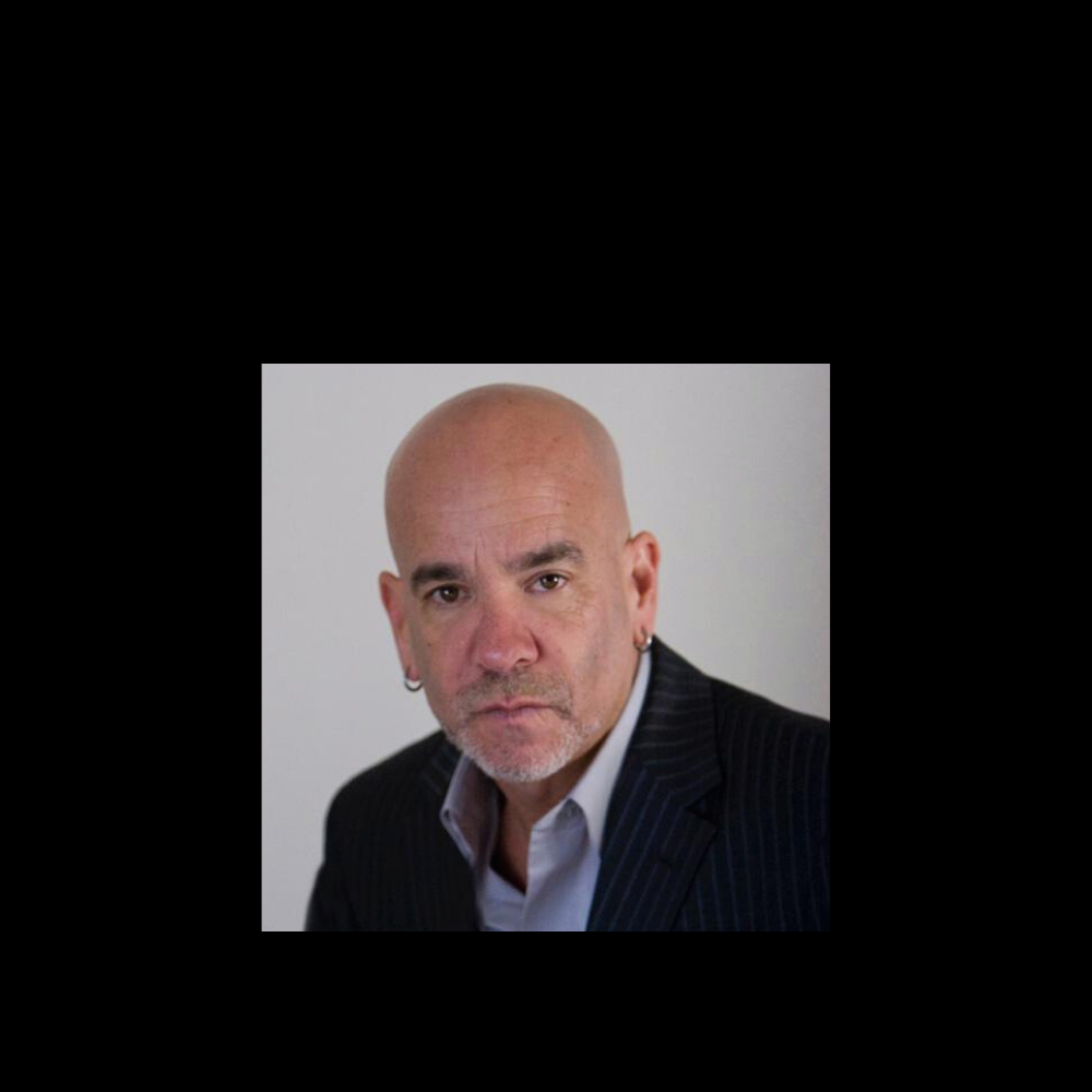 Man wearing a suit with a plain background